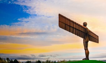 The angel of the north illuminated in the evening sun